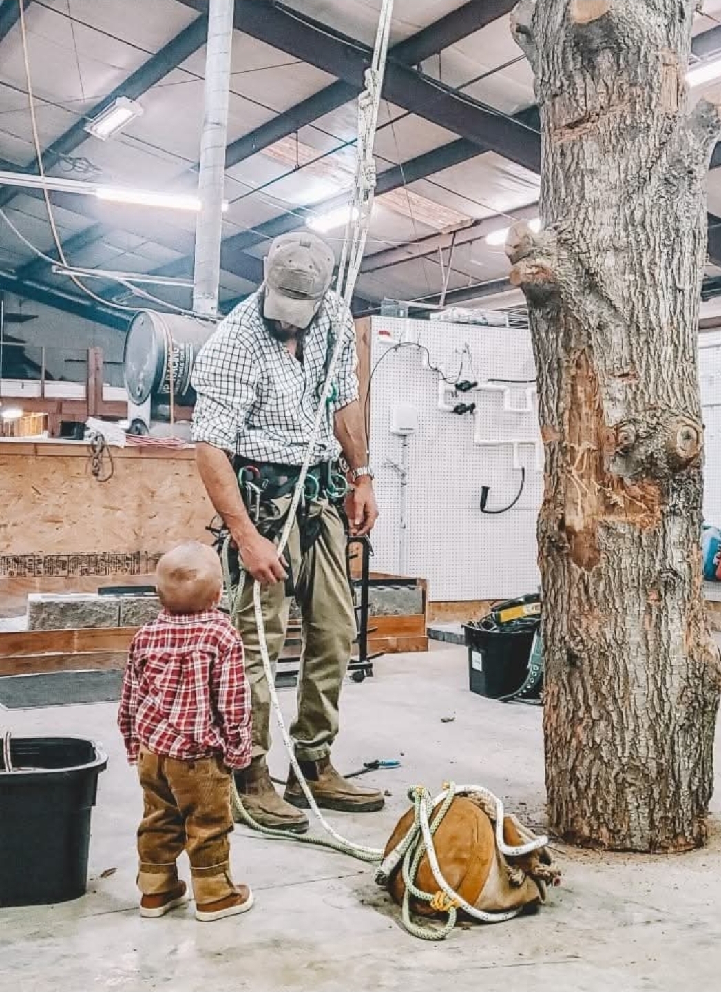 Jacob in the shop with one of his kids