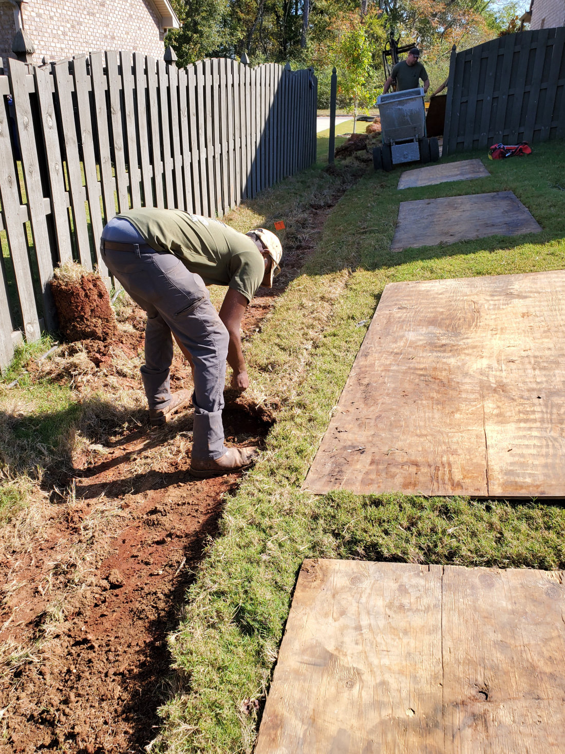 Landscaping crew laying sod